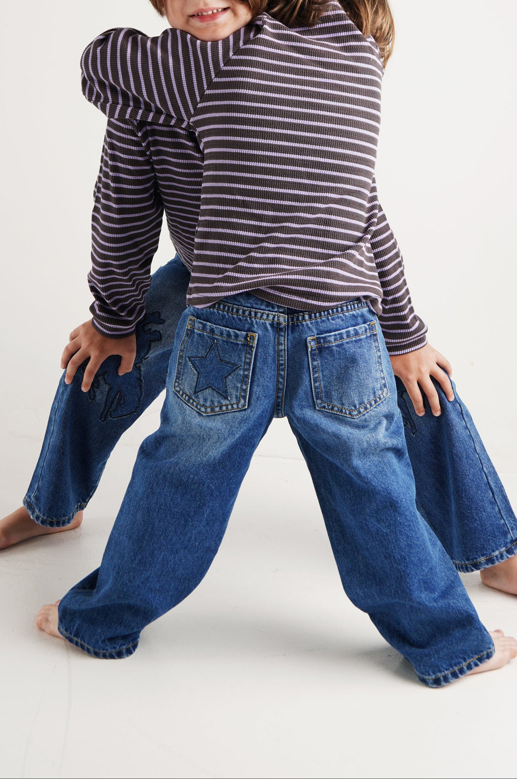 COWBOY PATCHED JEANS