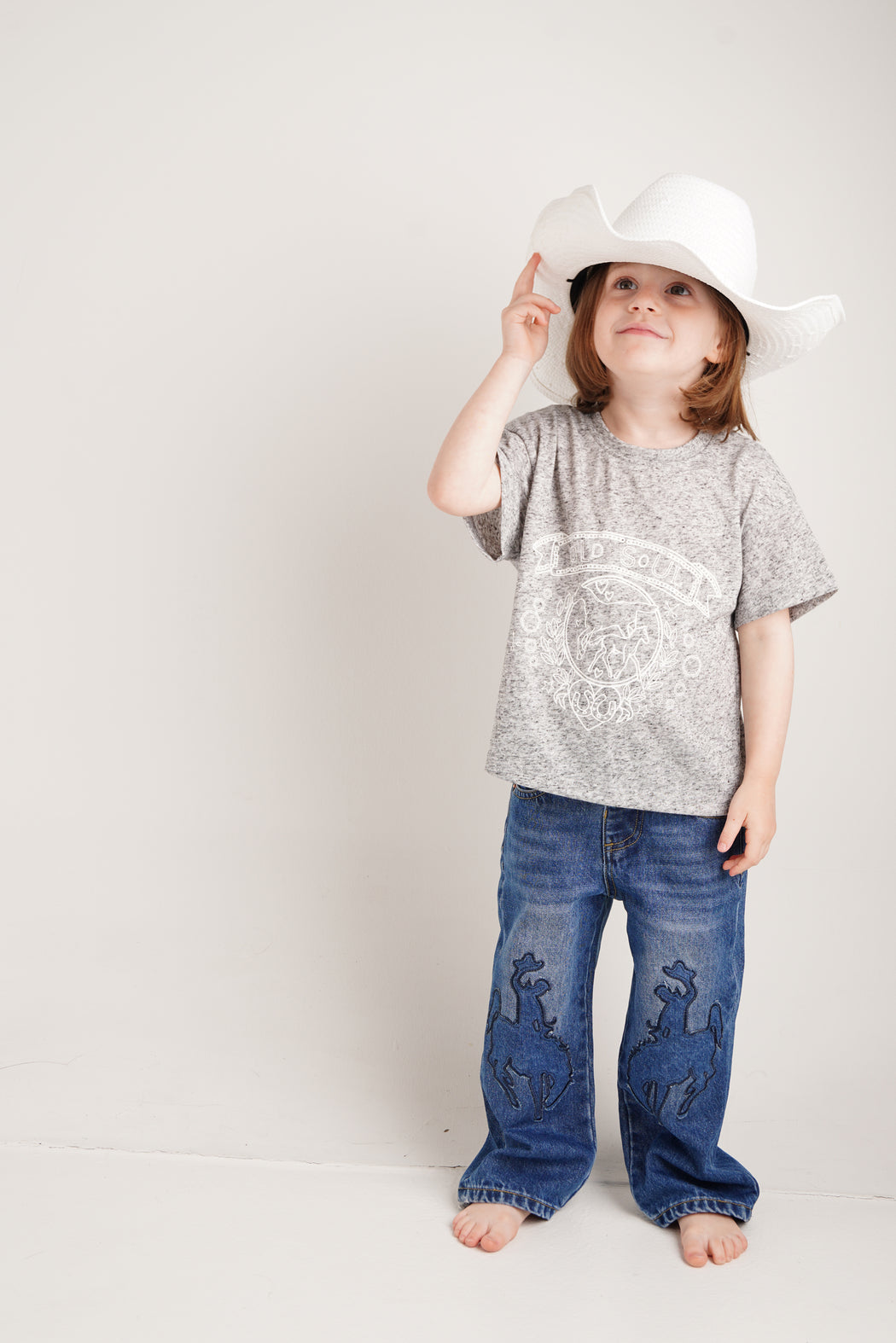 COWBOY PATCHED JEANS